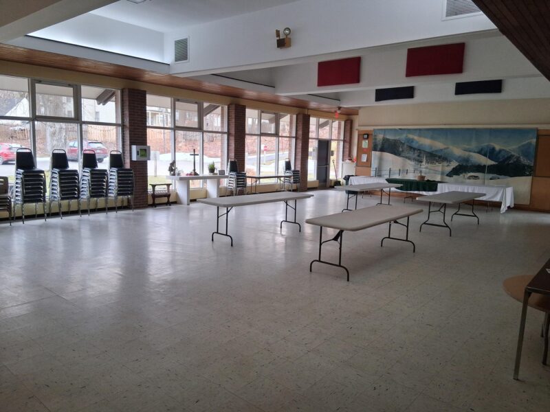 Empty hall with windows, chairs, tables